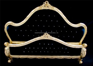 A Charles French Louis Style Bed In Gold Leaf and upholstered in a black velvet fabric with crystals